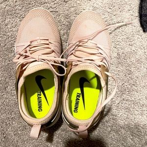 Blush Nike running shoes